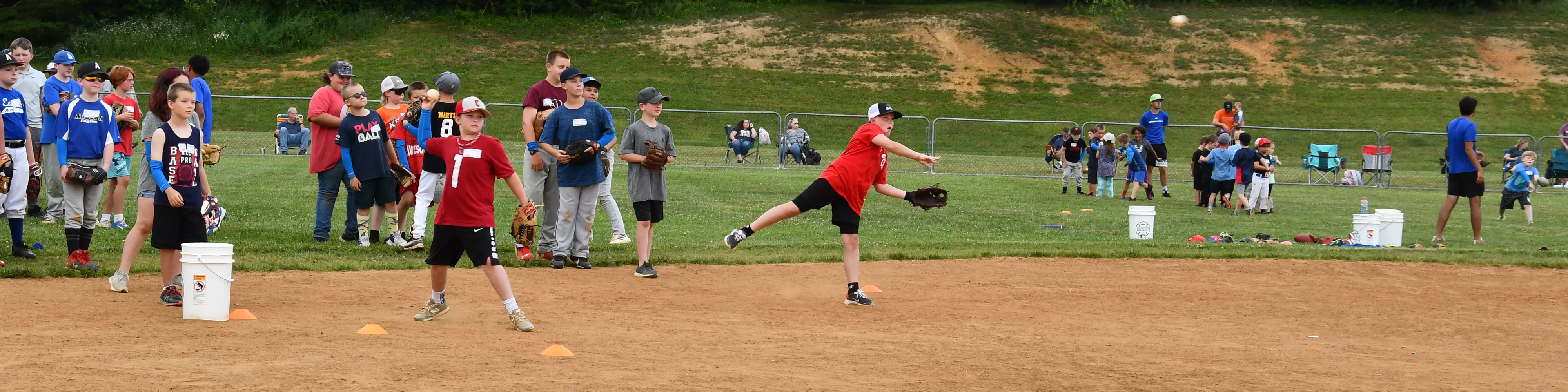 Children participate in a baseball clinic at Motor Mile Park.