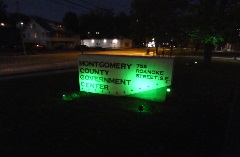 Montgomery County Government Center sign illuminated in green