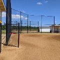 The backstop of one of the ballfields from the first base side.