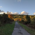 The Huckleberry Trail winds through Heritage Park towards the Gateway Trail with a view of Brush Mountain in the distance.