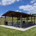 The picnic shelter at Motor Mile Park is located next to the baseball field and open green space.