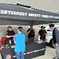 Sheriff's Office personnel chat with citizens at their information table.